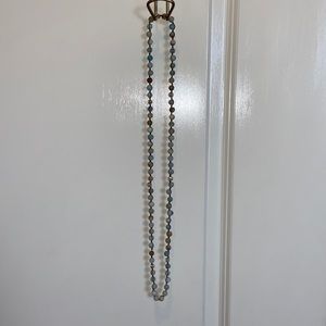 Long turquoise beaded and other beaded color necklace.